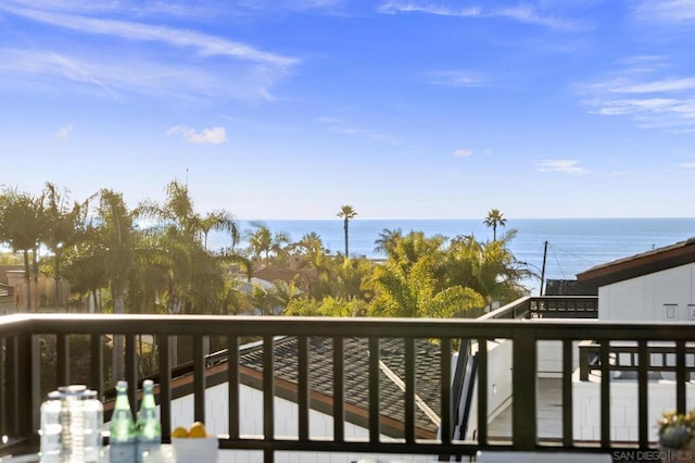 balcony featuring a water view