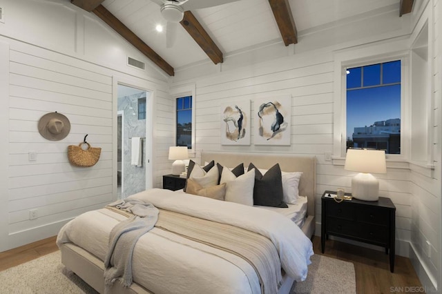 bedroom with vaulted ceiling with beams, wood-type flooring, and ceiling fan