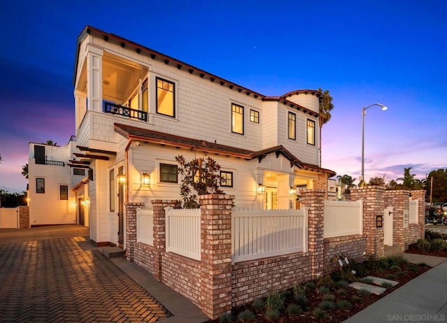 mediterranean / spanish home featuring a balcony