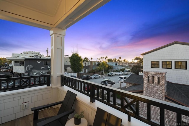 view of balcony at dusk