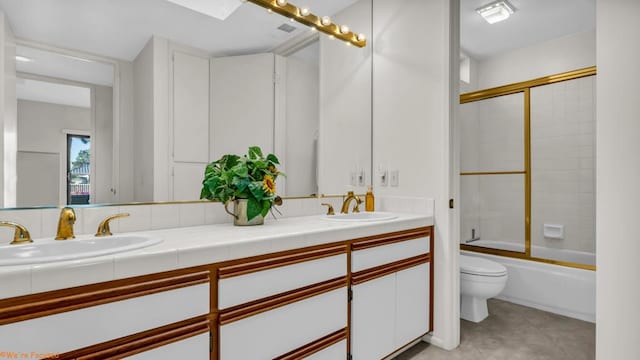 full bathroom with enclosed tub / shower combo, vanity, toilet, and tile patterned floors