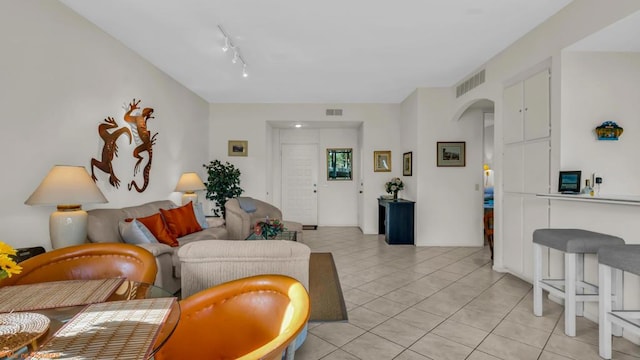 tiled living room with track lighting