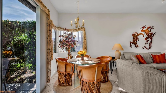 tiled dining space featuring an inviting chandelier