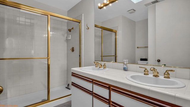 bathroom featuring vanity and an enclosed shower