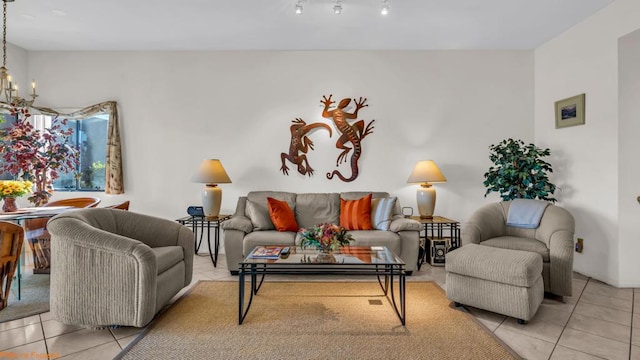 tiled living room featuring a chandelier