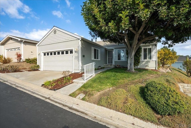 ranch-style home with a garage and a front yard