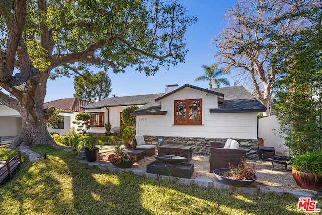 rear view of property with a patio area and a lawn