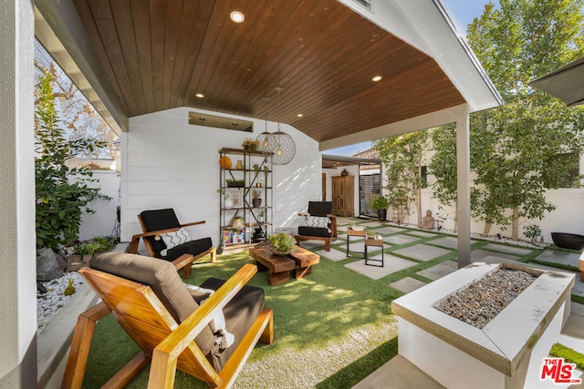 view of patio / terrace featuring a fire pit