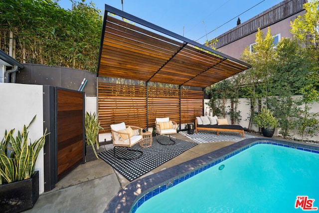 view of swimming pool with outdoor lounge area and a patio area