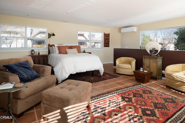 bedroom with multiple windows, a wall mounted air conditioner, and tile patterned floors