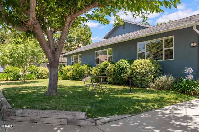 view of home's exterior with a yard