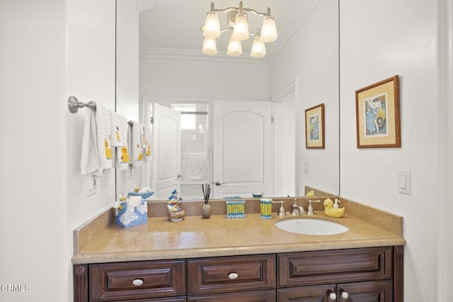 bathroom featuring ornamental molding, vanity, and a notable chandelier