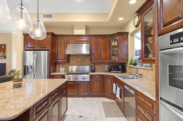 kitchen with appliances with stainless steel finishes, sink, decorative backsplash, hanging light fixtures, and ornamental molding