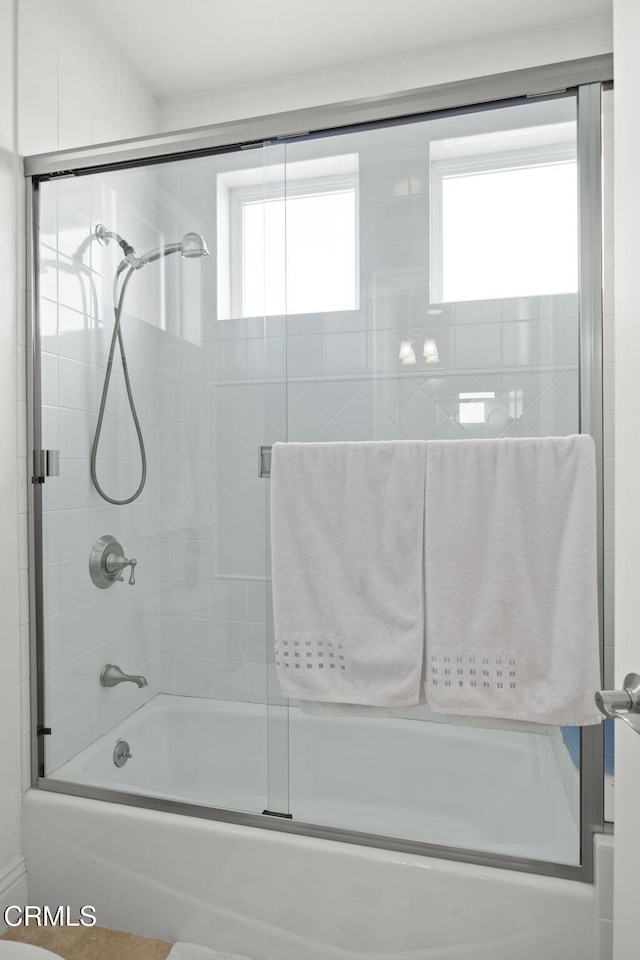 bathroom featuring enclosed tub / shower combo