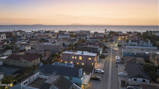 aerial view at dusk with a water view