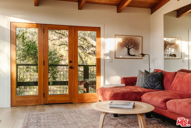 doorway featuring light hardwood / wood-style flooring, wooden ceiling, french doors, and beamed ceiling