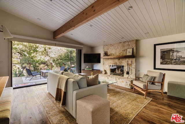 living room featuring radiator heating unit, dark hardwood / wood-style floors, a stone fireplace, and vaulted ceiling with beams