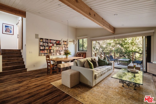 living room featuring lofted ceiling with beams and hardwood / wood-style flooring