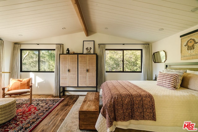 bedroom with hardwood / wood-style floors, multiple windows, and vaulted ceiling with beams