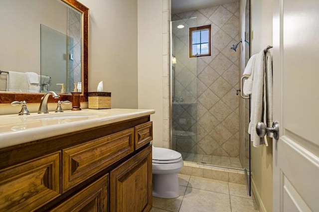 bathroom with vanity, a shower with shower door, tile patterned floors, and toilet