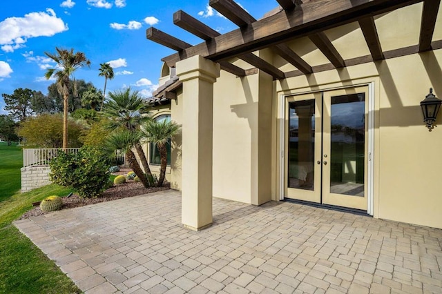 view of patio featuring a pergola and french doors