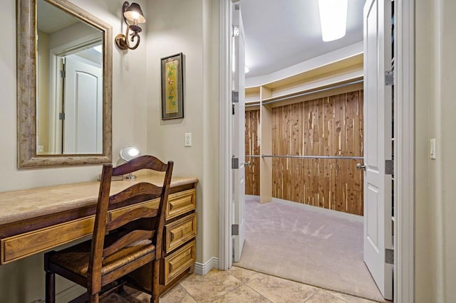 bathroom featuring wooden walls