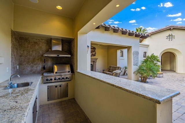 view of patio featuring area for grilling, sink, and grilling area