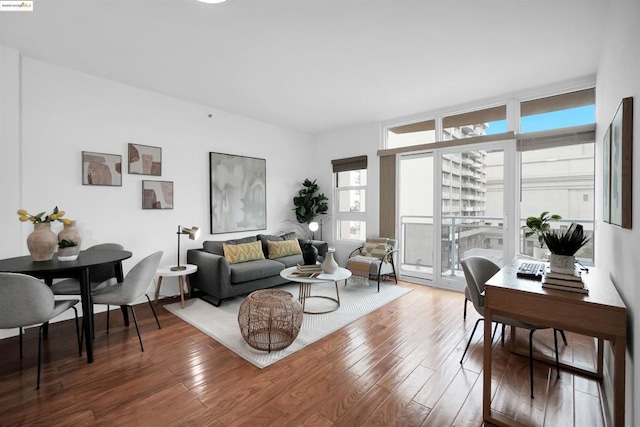 living room featuring hardwood / wood-style flooring and floor to ceiling windows