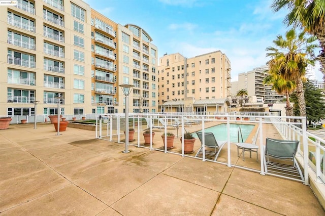 view of swimming pool featuring a patio