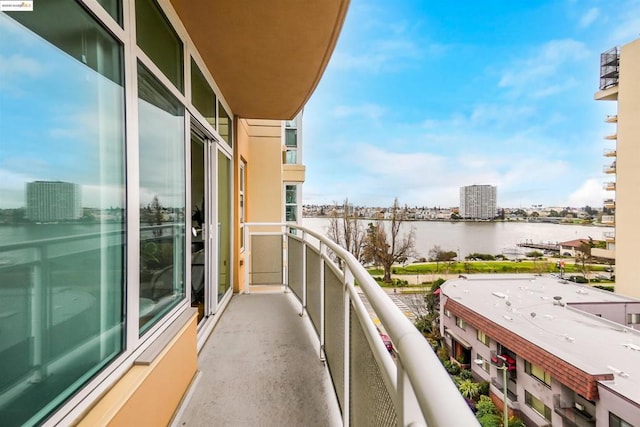 balcony featuring a water view