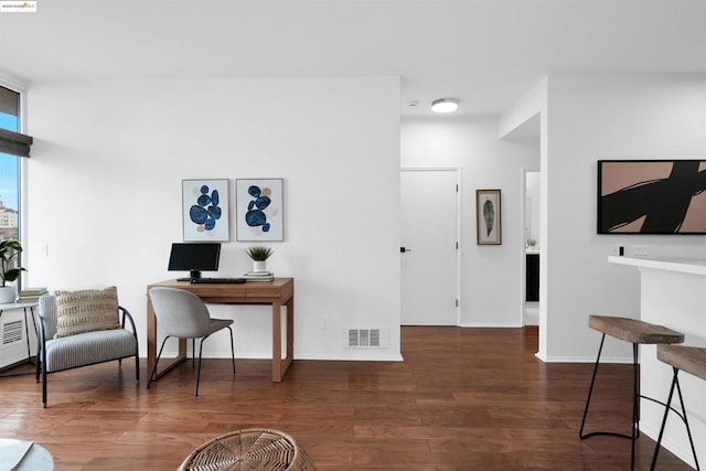 office with dark hardwood / wood-style flooring