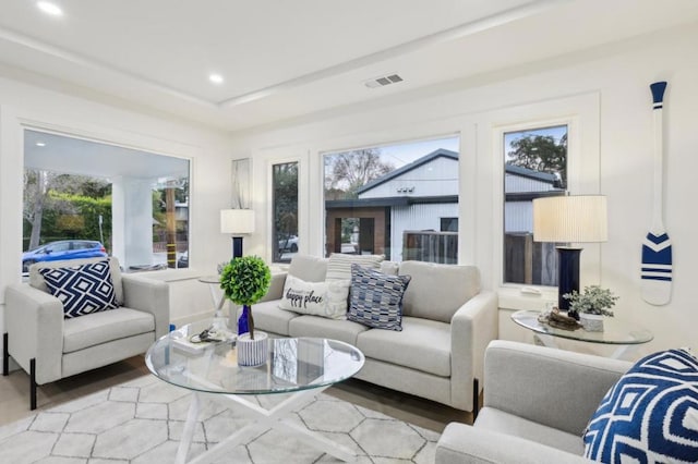 living room with plenty of natural light and wood-type flooring