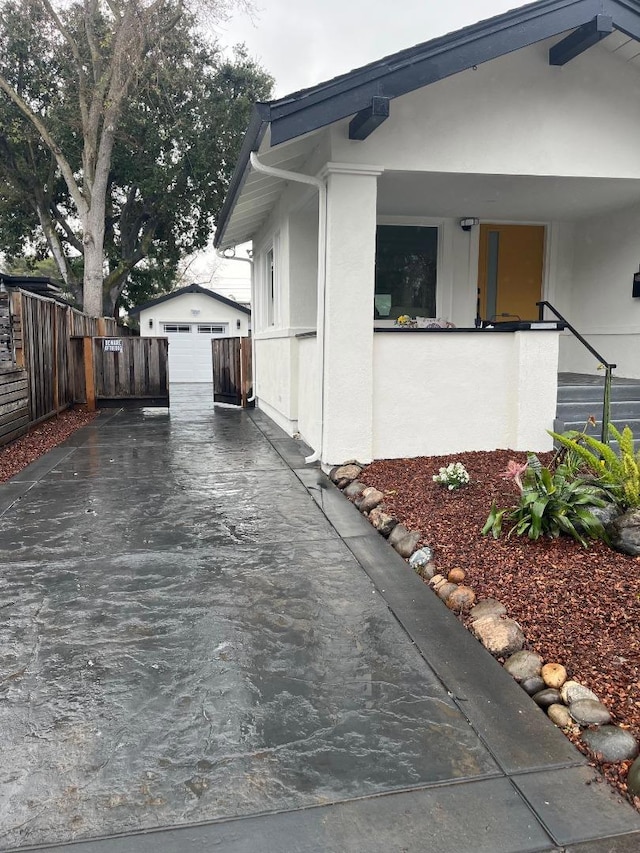 view of home's exterior with an outbuilding and a garage