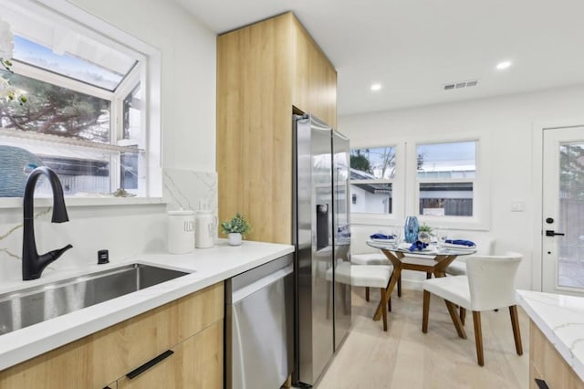 kitchen featuring sink and appliances with stainless steel finishes