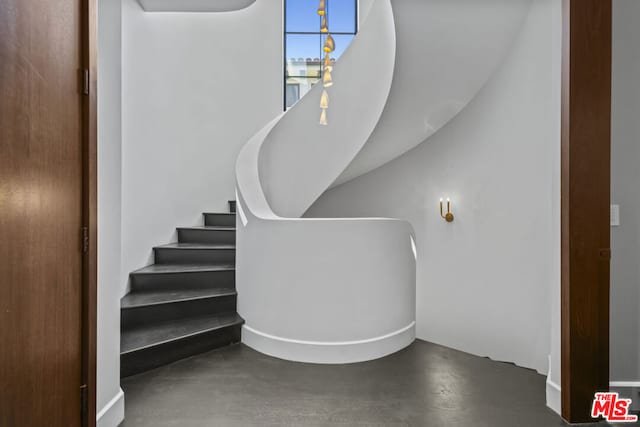 stairway with concrete floors