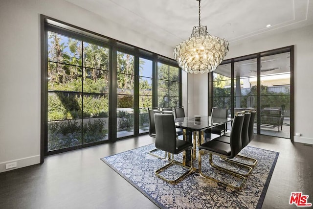 dining area featuring hardwood / wood-style floors and a chandelier