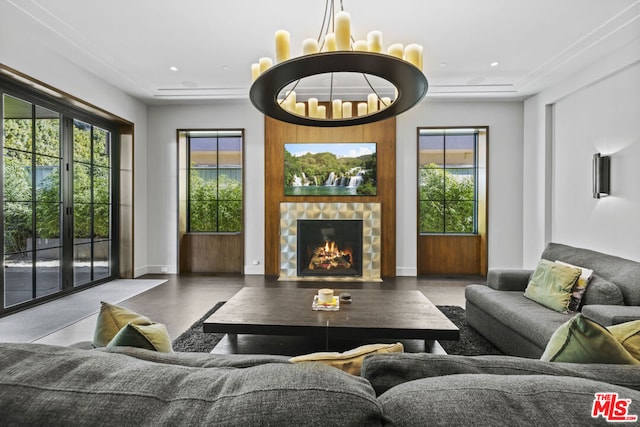 living room with plenty of natural light and a chandelier