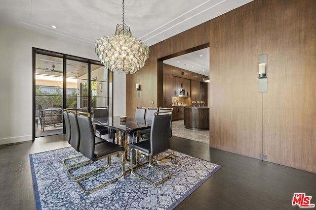 dining room featuring dark hardwood / wood-style floors and a chandelier