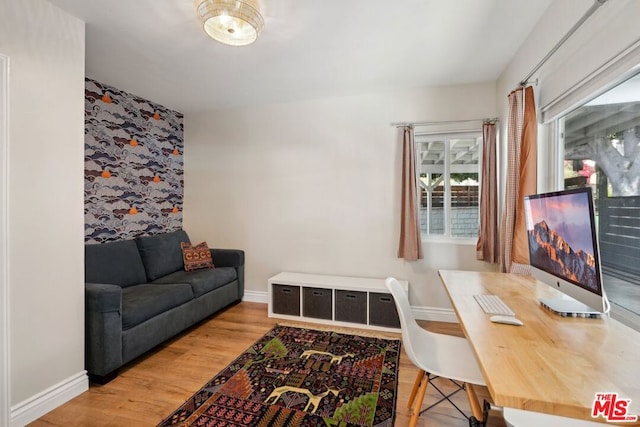 home office with hardwood / wood-style flooring