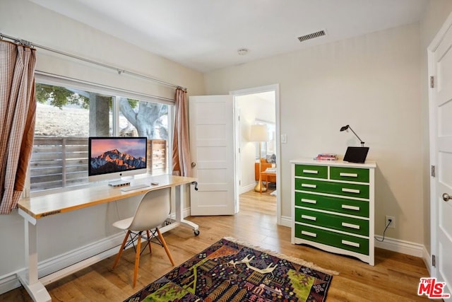 office with hardwood / wood-style flooring