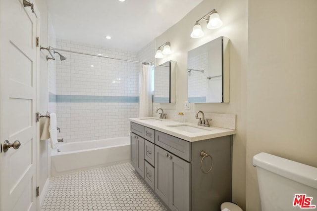 full bathroom with vanity, shower / tub combo, tile patterned floors, and toilet