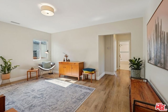 sitting room with light hardwood / wood-style flooring