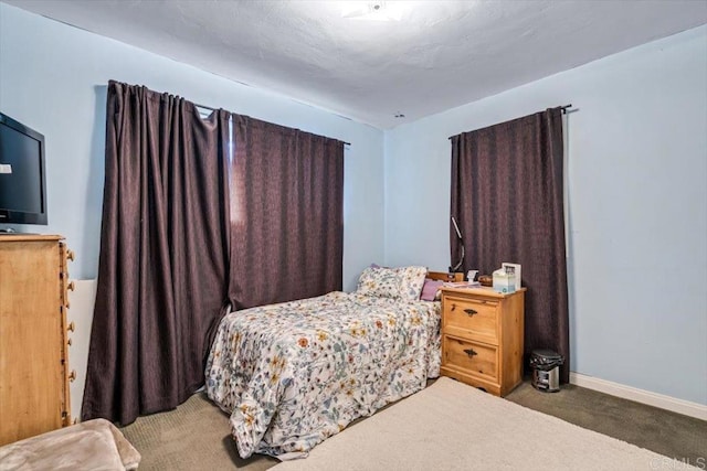 bedroom with dark carpet