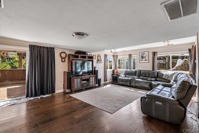 living room featuring dark wood-type flooring