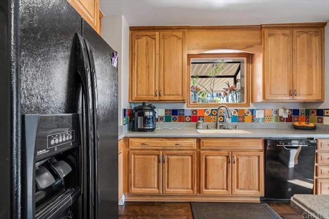 kitchen with sink and black appliances