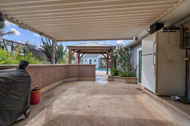 view of patio / terrace featuring a gazebo and area for grilling