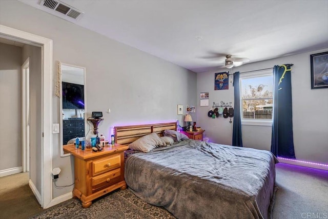 bedroom featuring ceiling fan and carpet