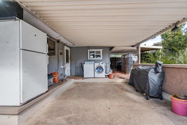 view of patio featuring a grill and washer and dryer