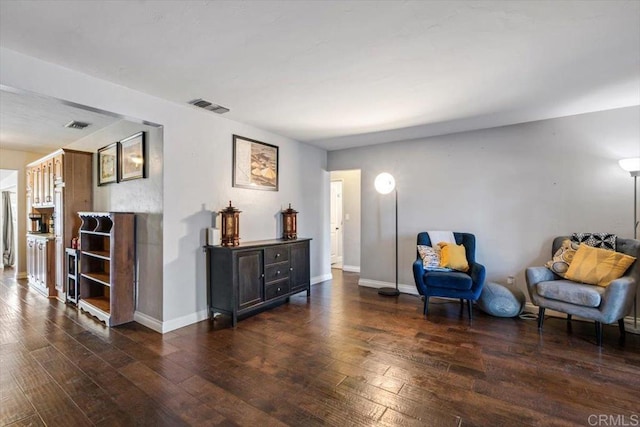 living area with dark hardwood / wood-style flooring