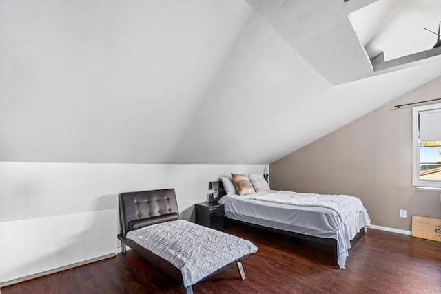 bedroom featuring lofted ceiling and dark hardwood / wood-style flooring